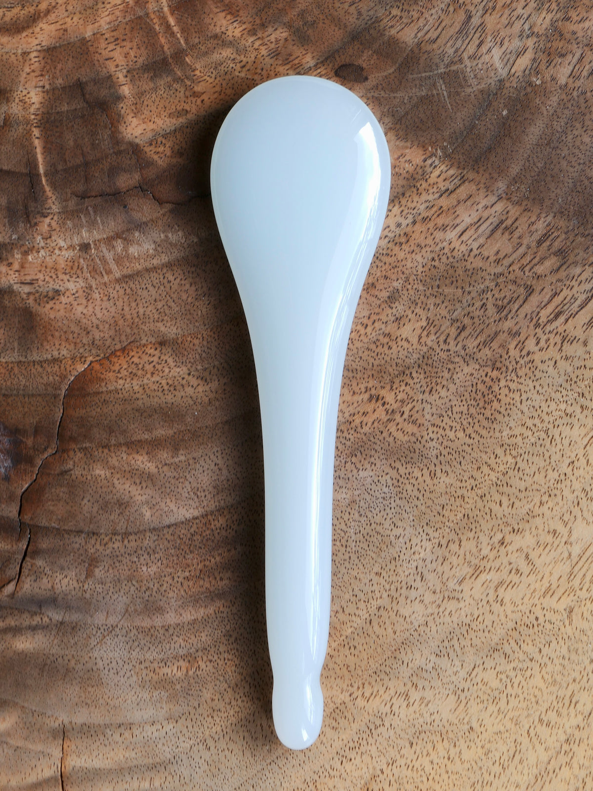 Front side of a jade gua sha spoon