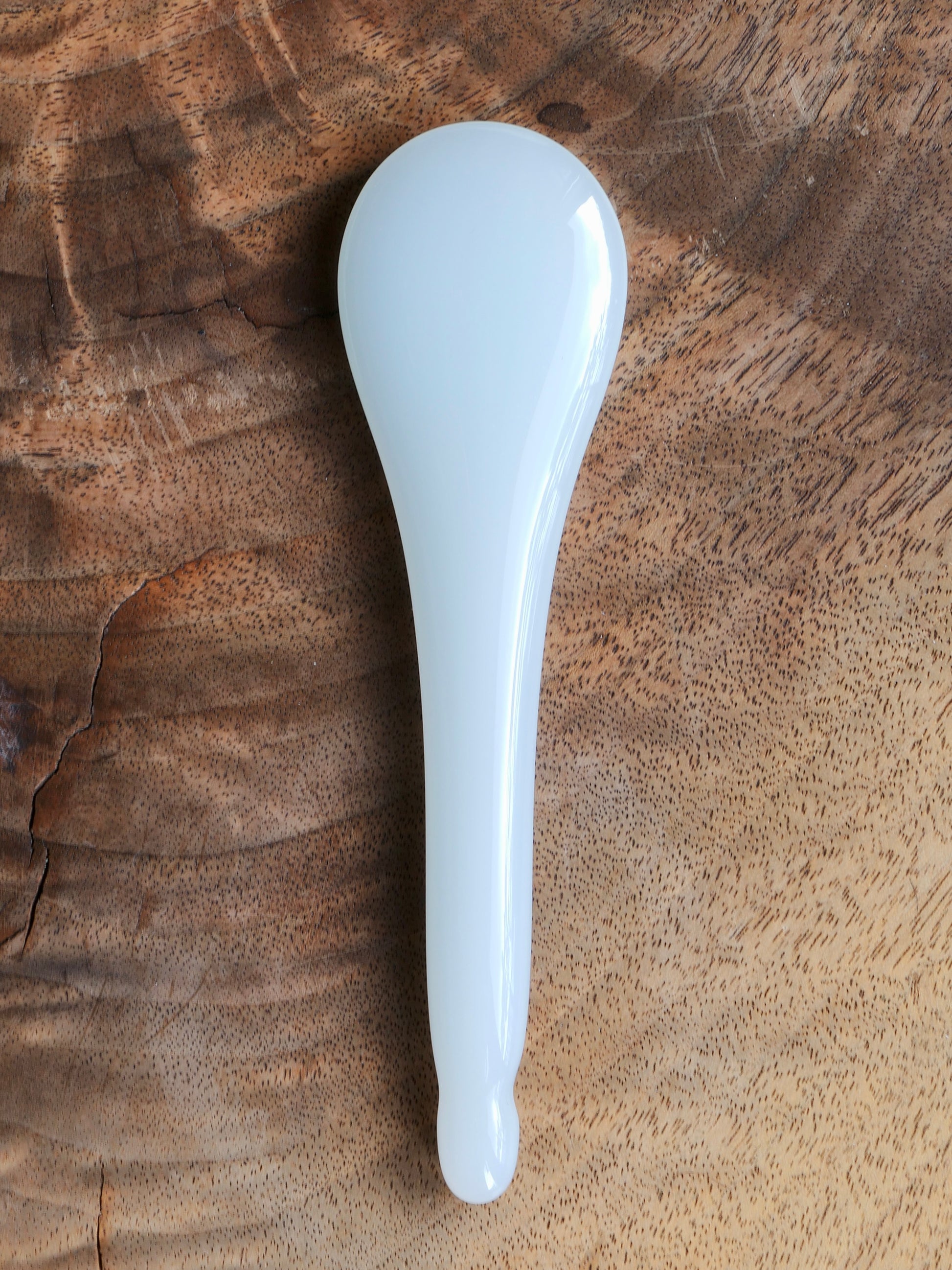 Front side of a jade gua sha spoon