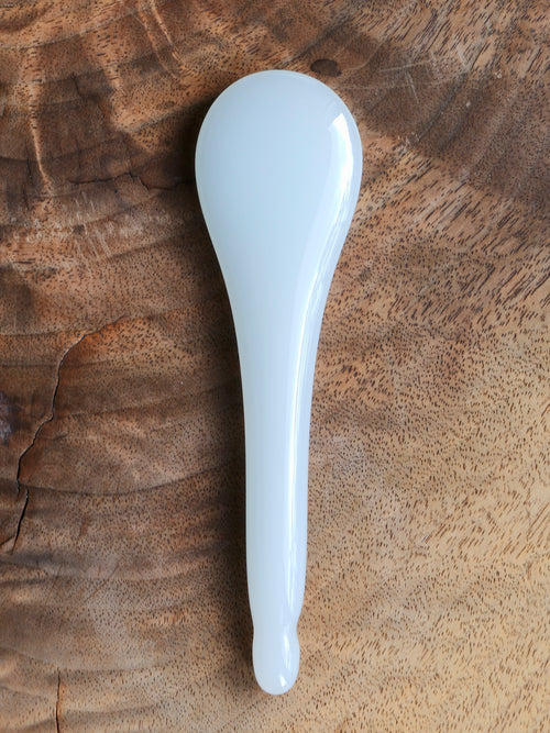 Front side of a jade gua sha spoon