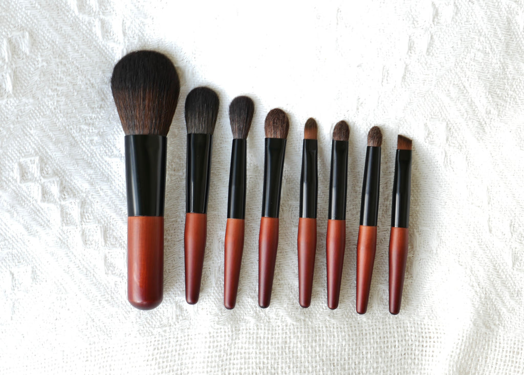 Set of 8 mini makeup brushes with brown and black handles